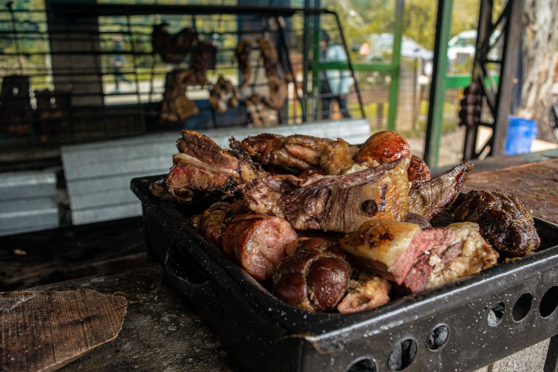 Meat cooking over the charcoal grill
